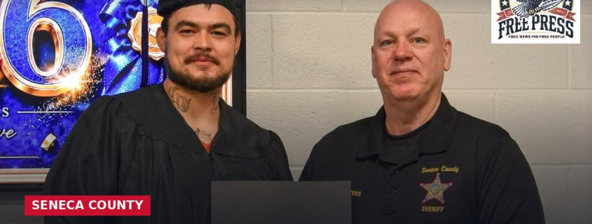 Fostoria News Jail inmate and sheriff's officer at GED graduation ceremony in Seneca County.